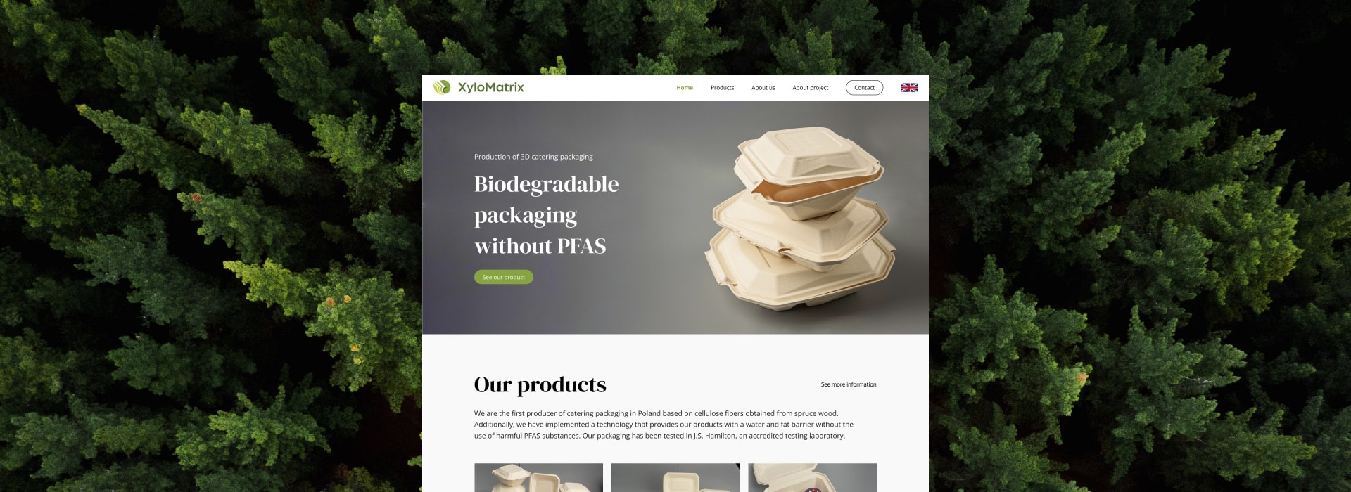Mockup of the XyloMatrix website on a laptop, against forest greenery.